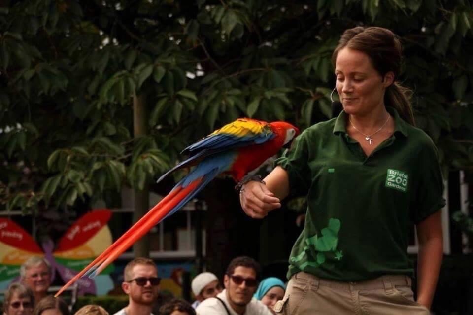 Charlotte holding a parrot
