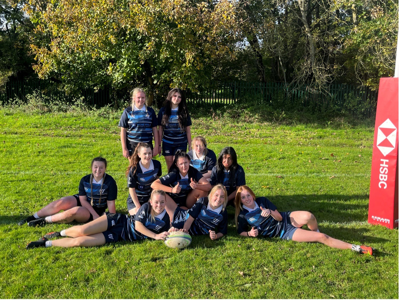 Weston sport girls rugby team picture on pitch