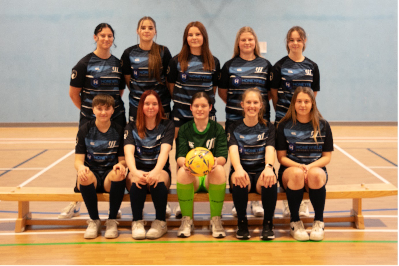 Weston sport girls football team picture in sports hall