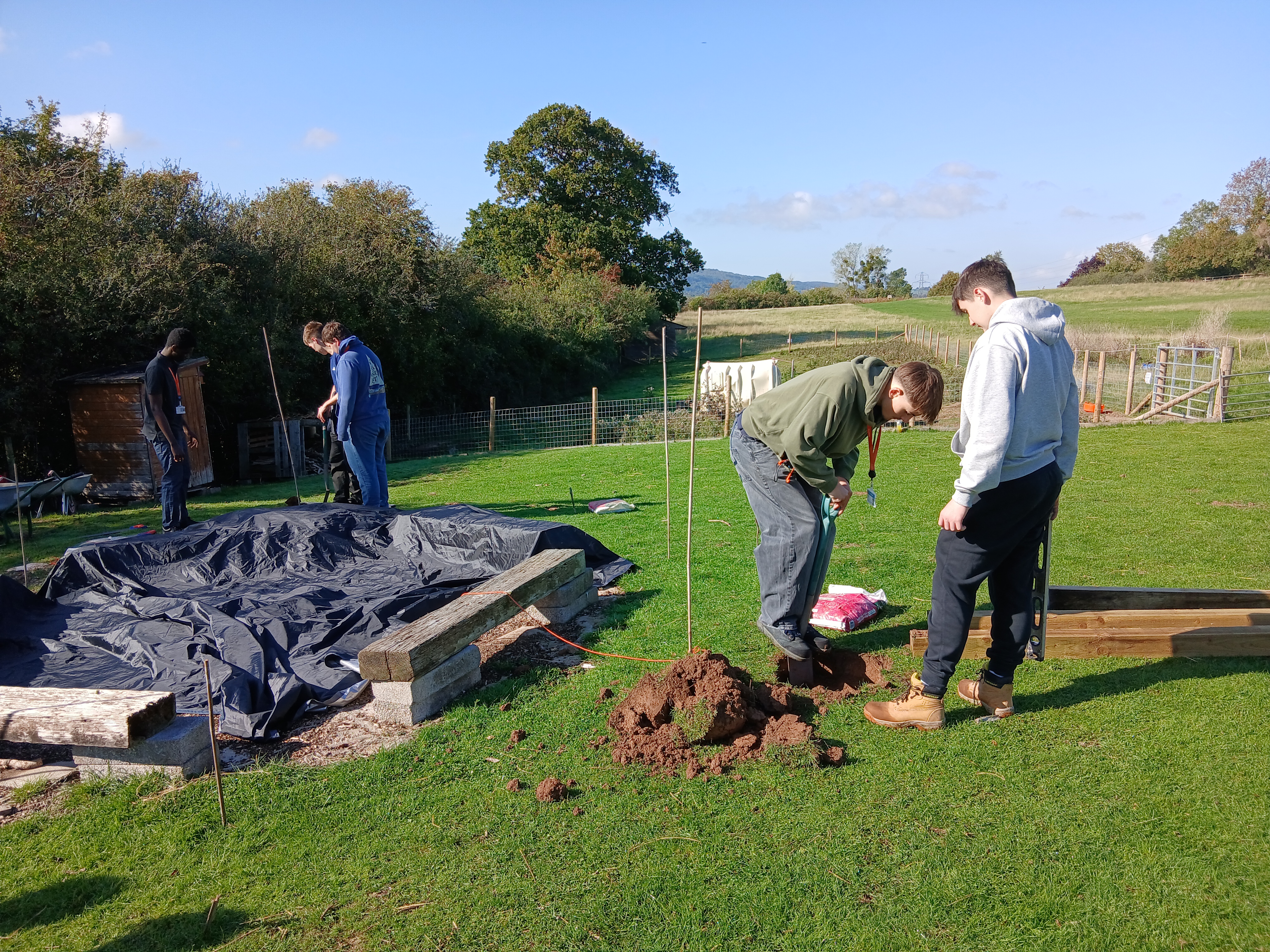 Students digging holes