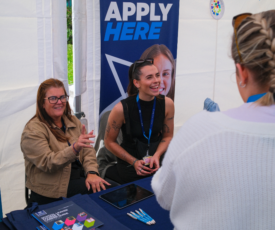 Admissions team speaking to attendees
