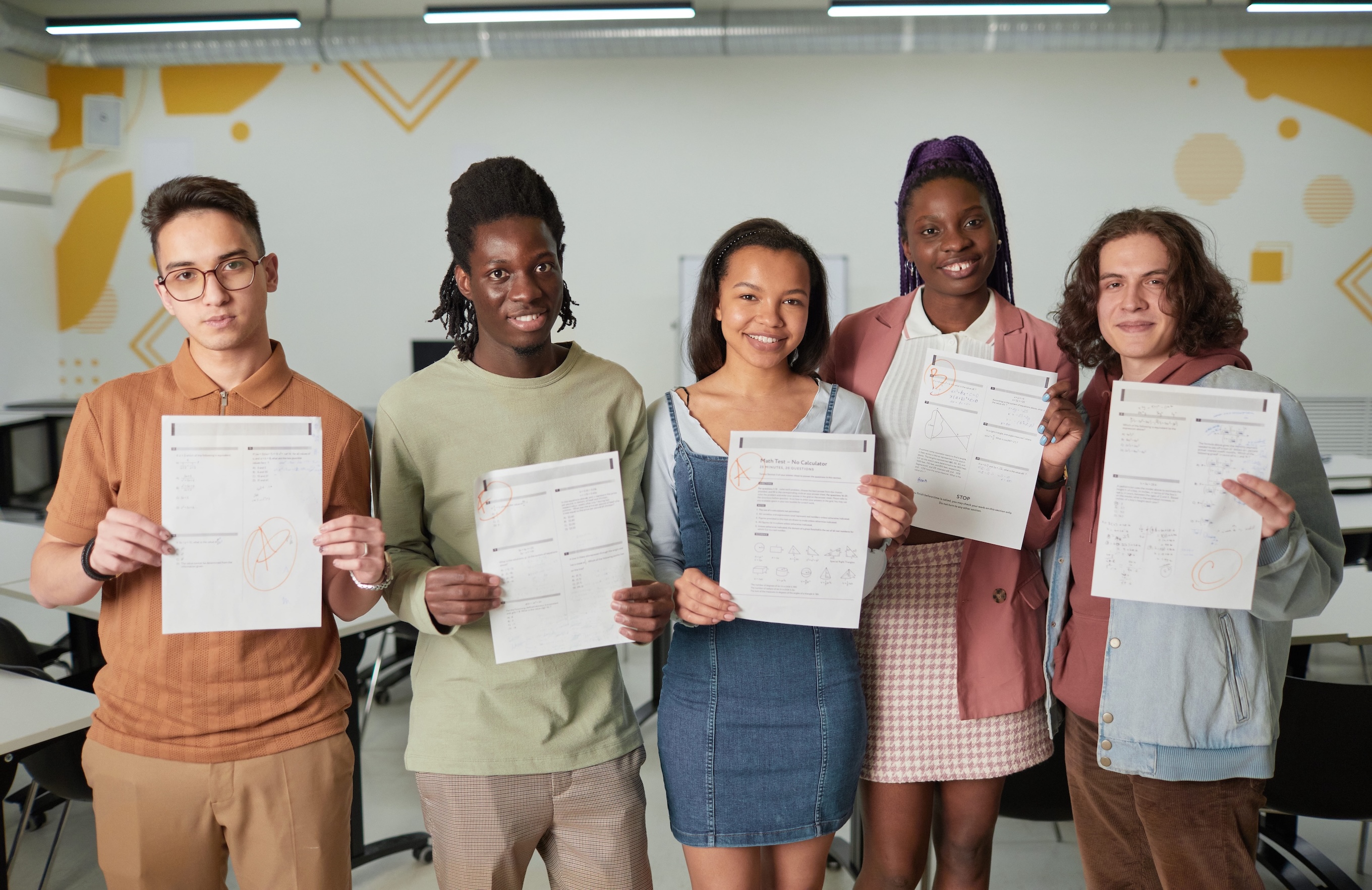 a group of people holding up certificates