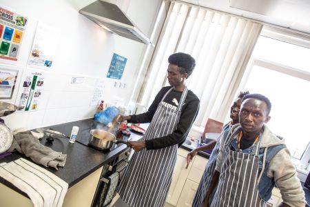 Learner boiling up a sauce in the kitchen