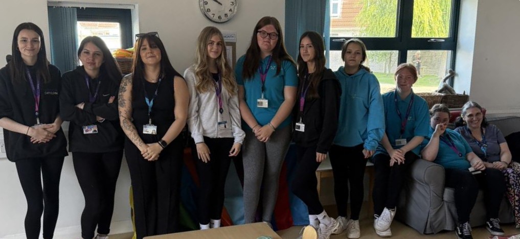 early years students smiling in picture at ashcombe children's centre