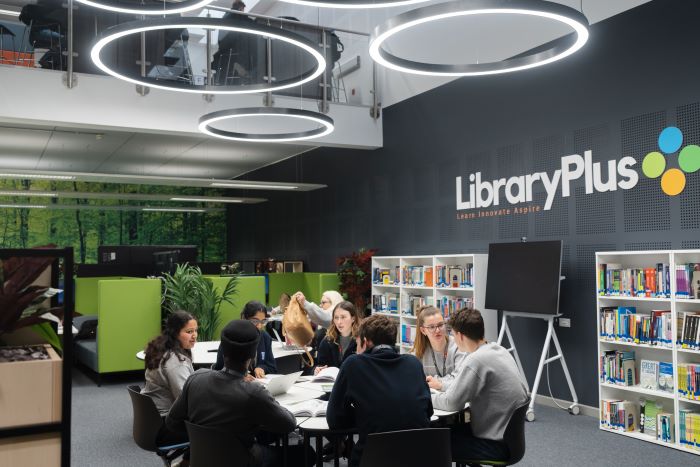 A group of learners studying in the library
