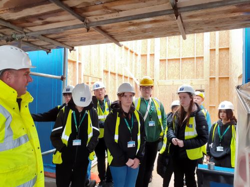 Learners listening to the talk on site