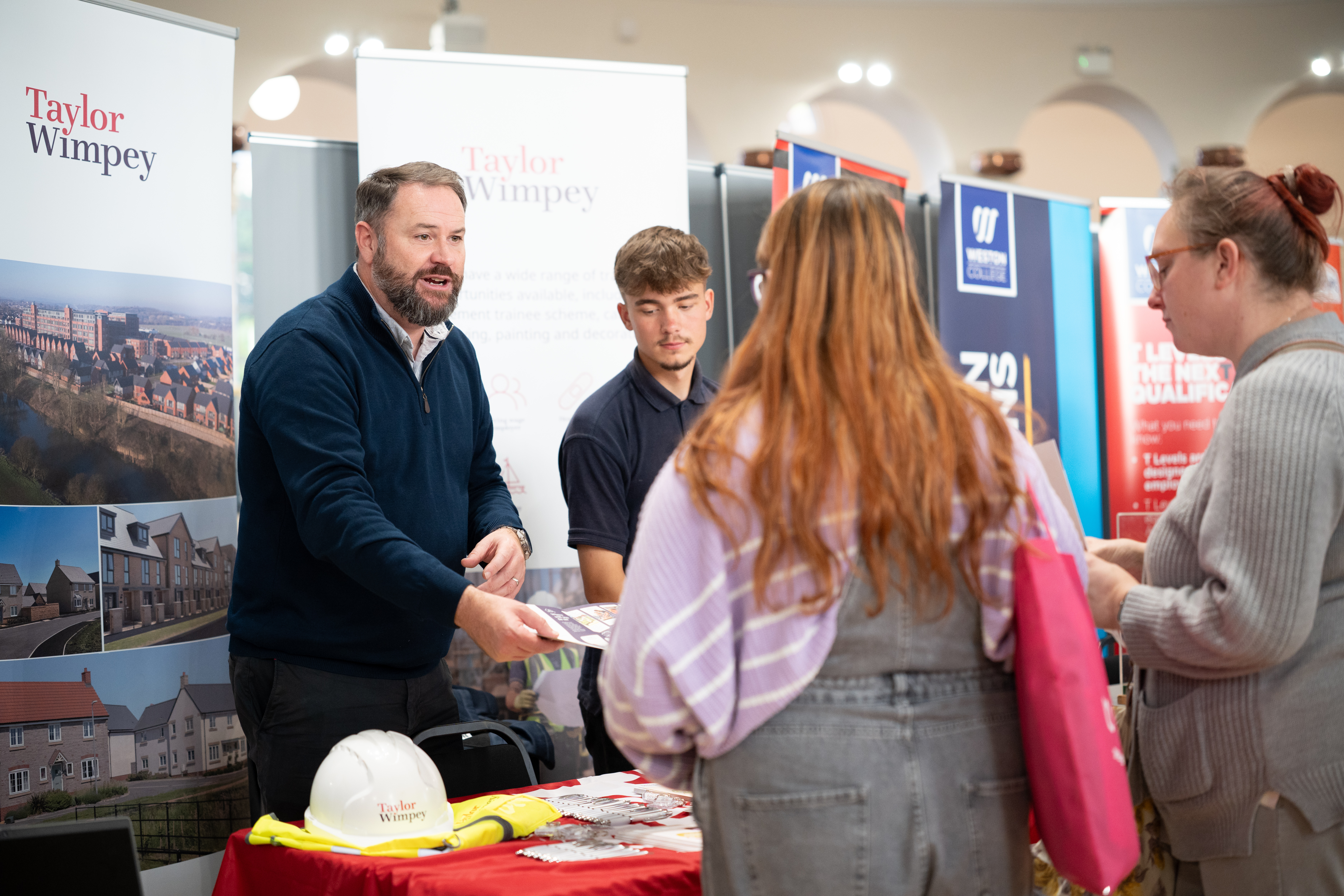 Attendees talking to employer, Taylor Wimpey