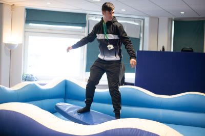 Learner having a go on the surf machine