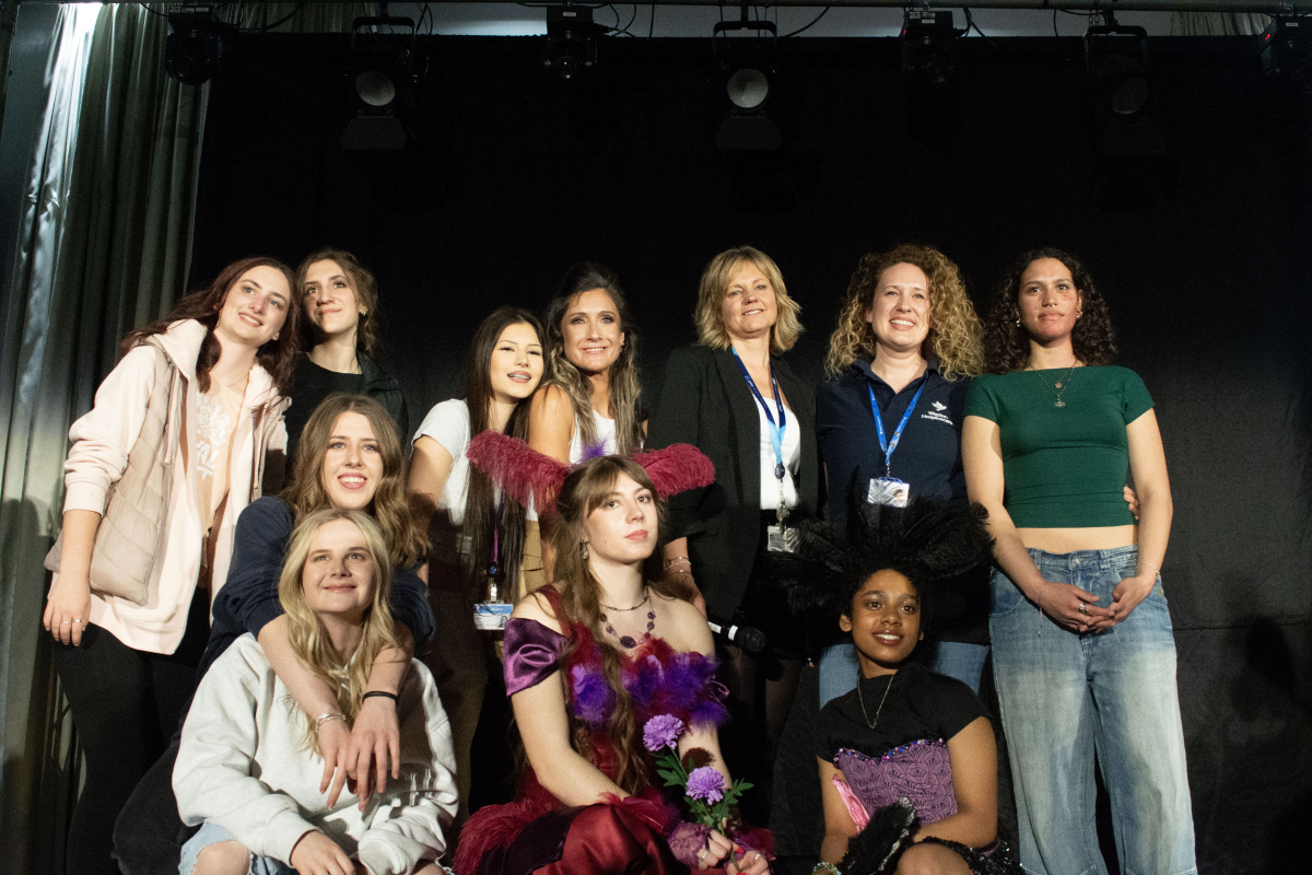 Group photo of staff and students smiling