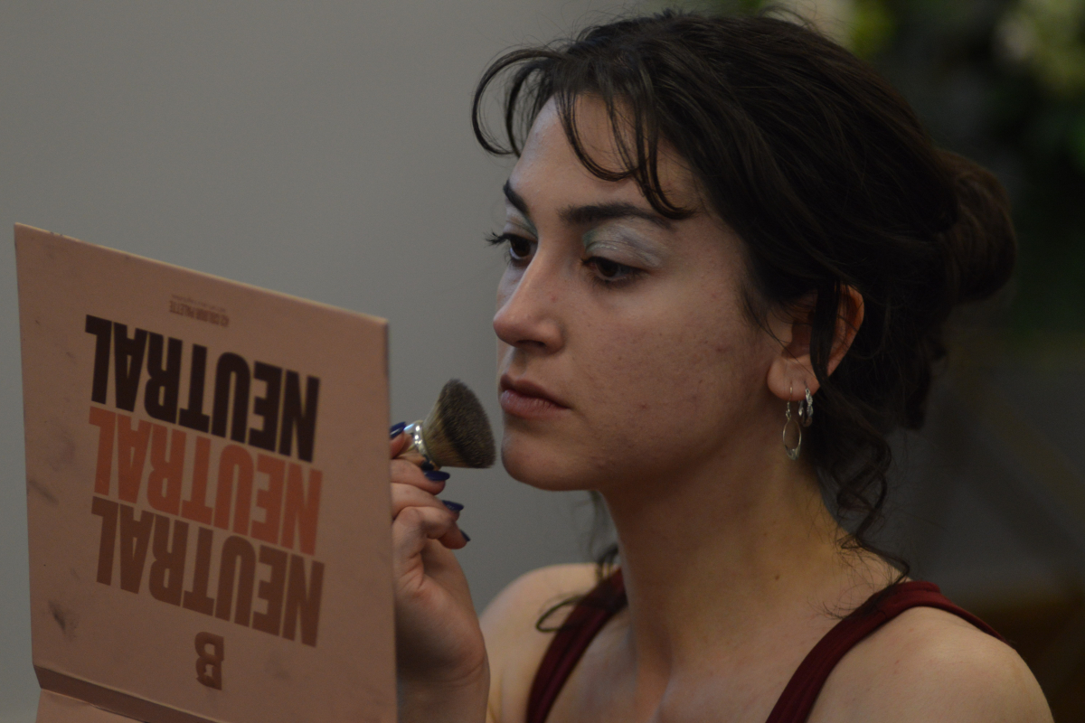 Student applying their makeup