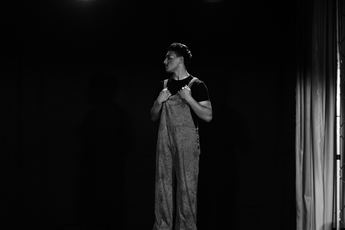 Black and white photo of model in dungarees 