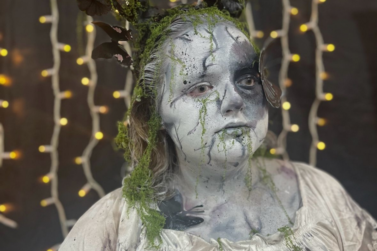 Student with ghostly black and white face paint