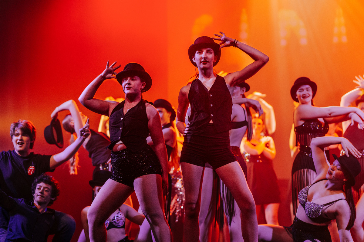 Two learners dancing in a pair from the dress rehearsal