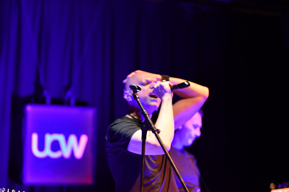 The Peripheries Lead Singer singing on stage 