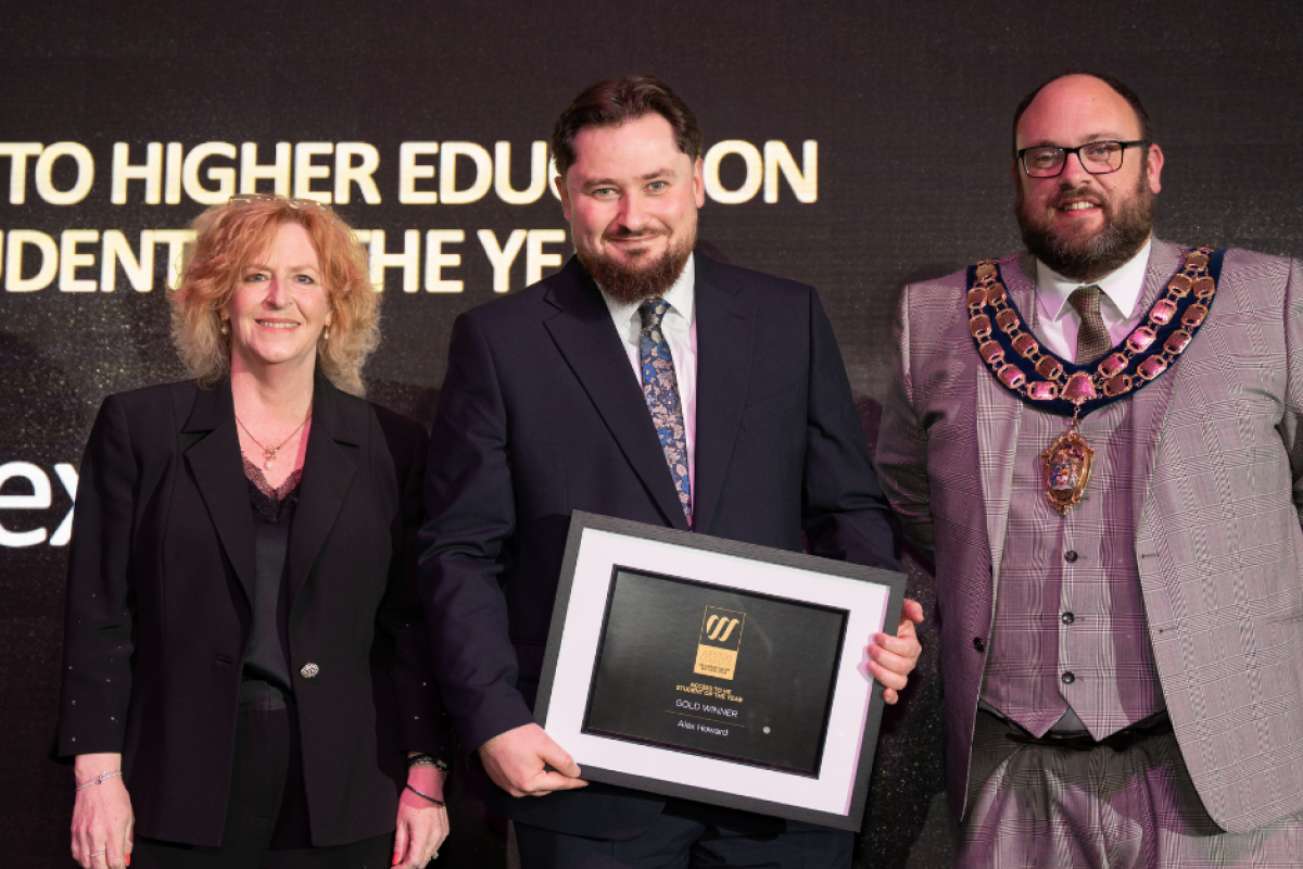 Alex collecting his award at Celebration of Success 2025