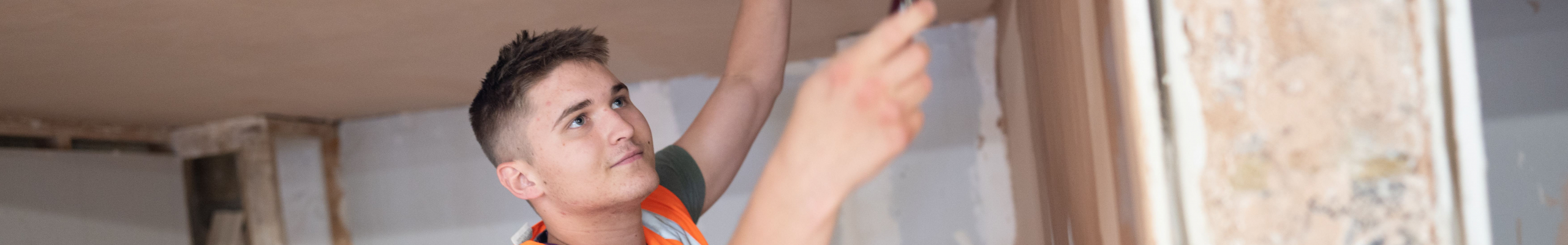 Student plasterer plasters