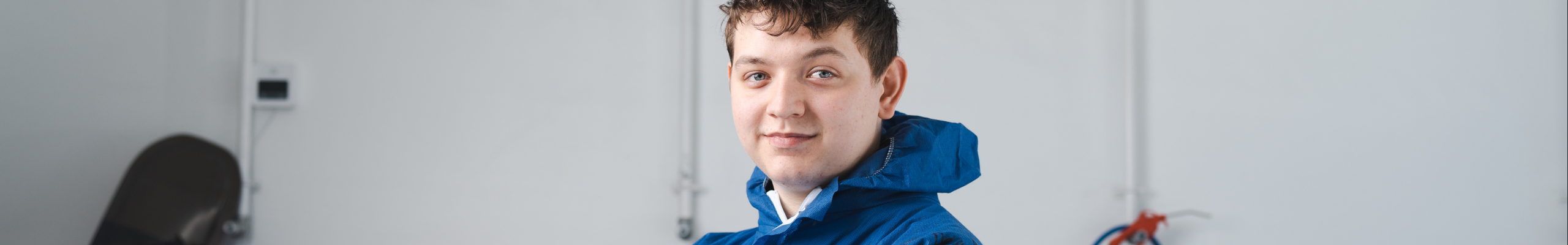 student wearing overalls studying engineering at weston college near bristol