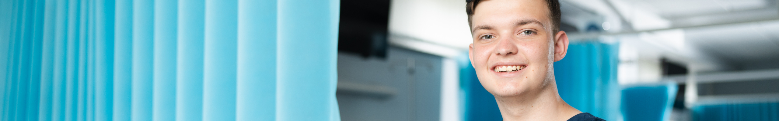 male health learner posing in health facility 