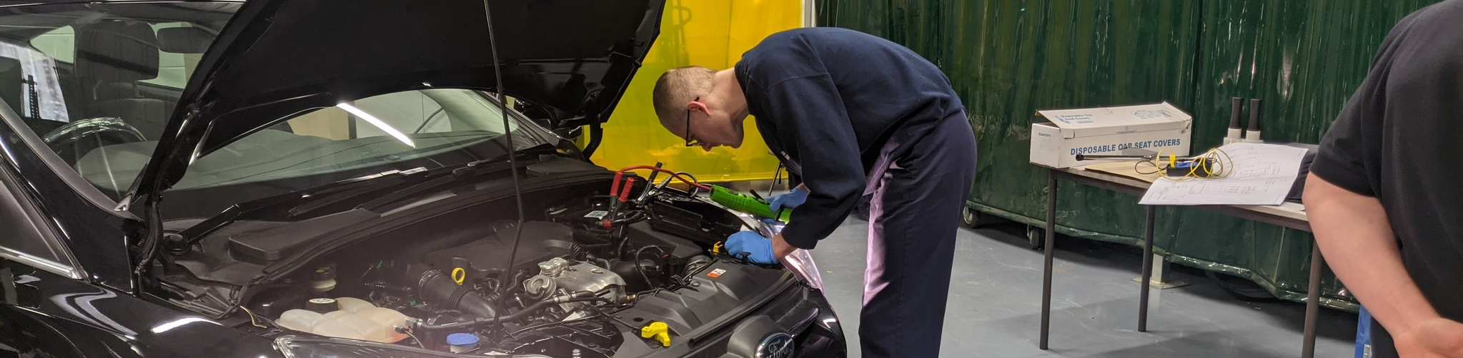 Luke fixing car