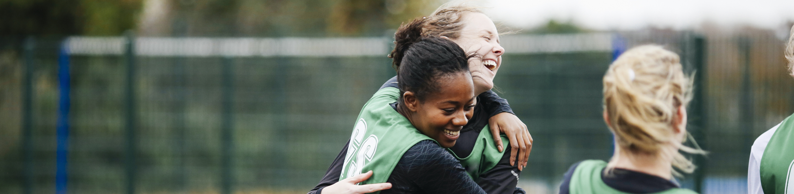 Female netball players celebrating 