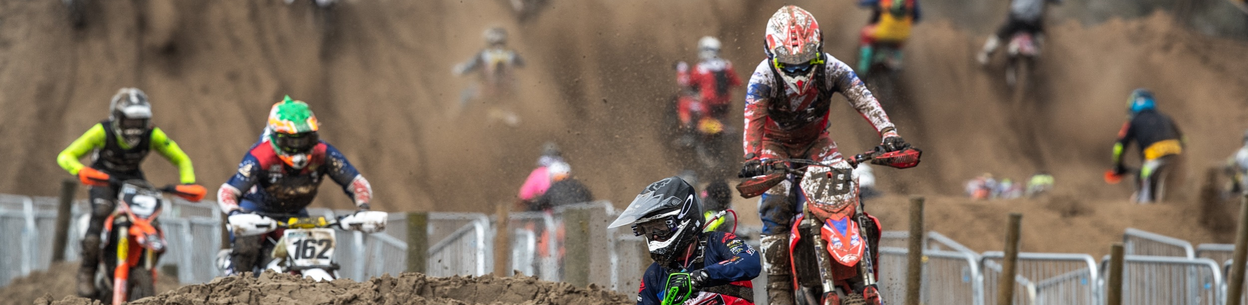 Motorsport bikers racing along Weston-super-Mare beach at Weston Beach Race