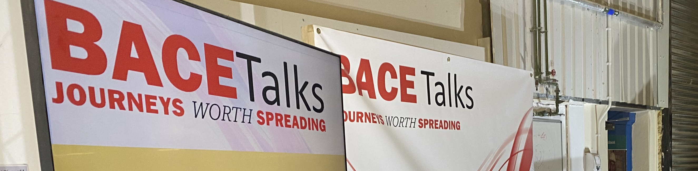 BACE Talks logo appearing on the screen which is sat in front of BACE Talks backdrop