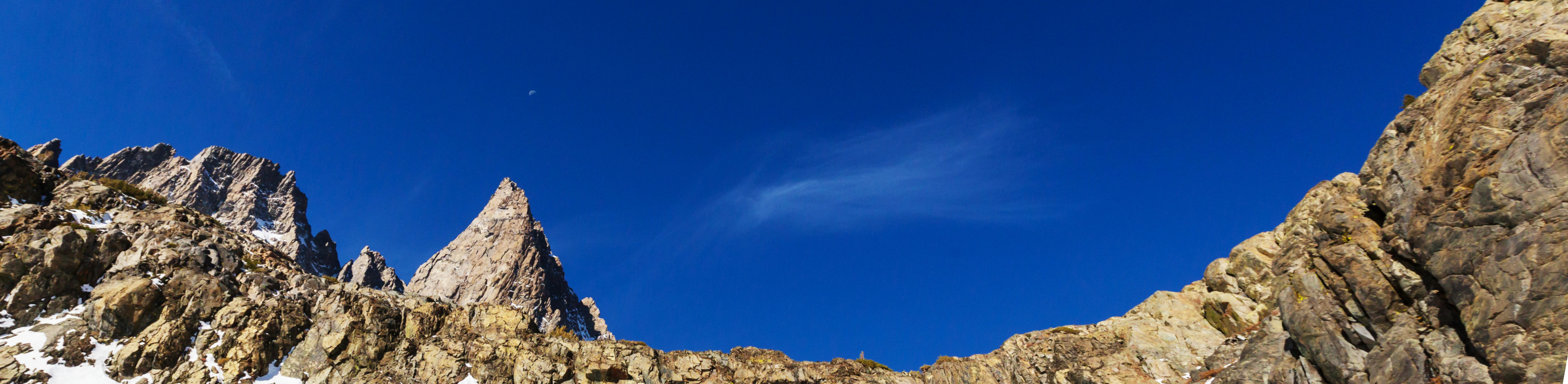 rocky mountain in front of blue sky