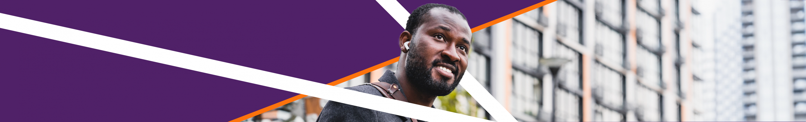 Smiling man looking into the distance with AirPods in