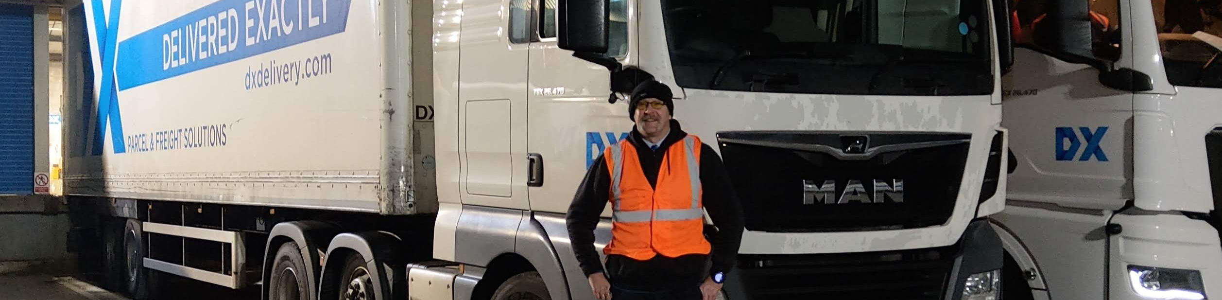 Jonathan stood in front of his lorry