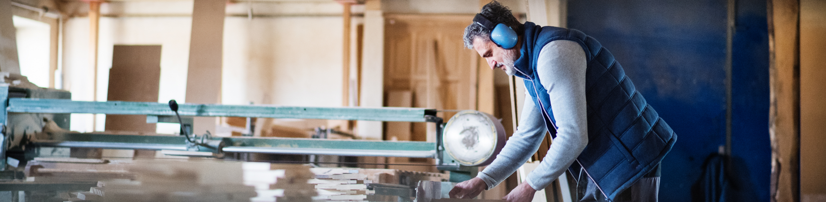 Man working with wood for his carpentry task