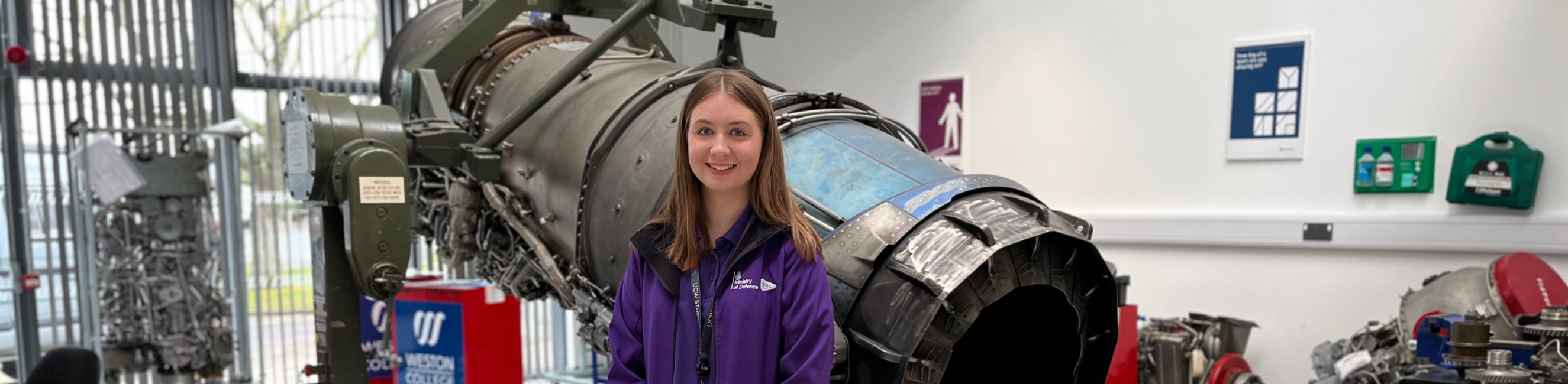Georgia stood in front of engine, smiling