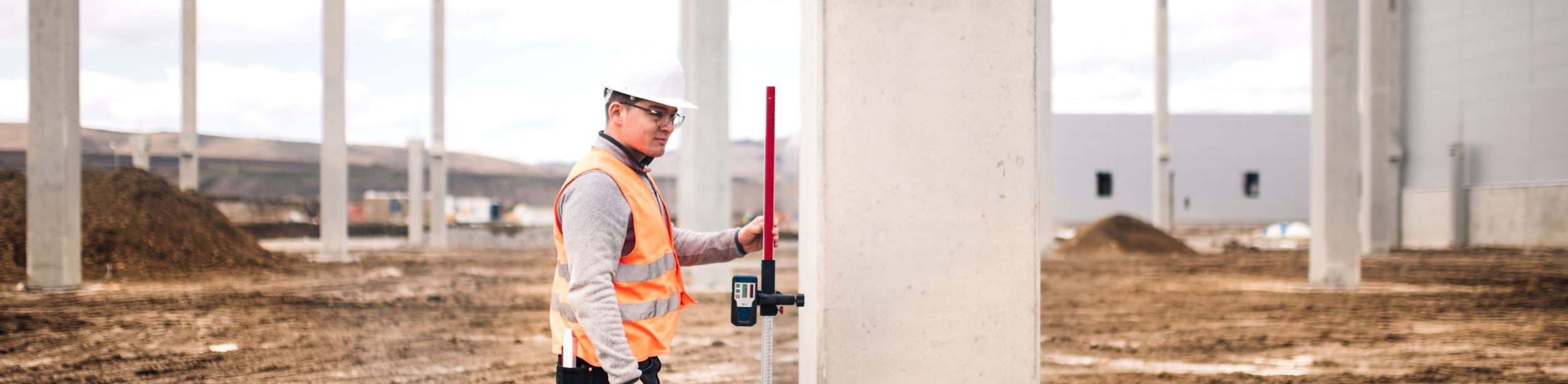 Civil Engineer surveying land with theodolite equipment