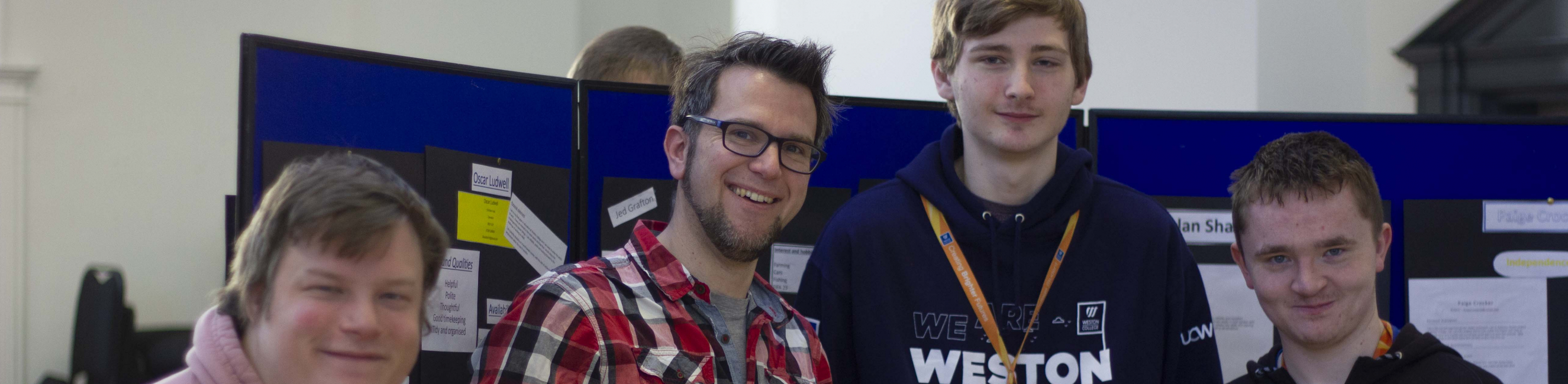 Employer with learners at reverse career fair