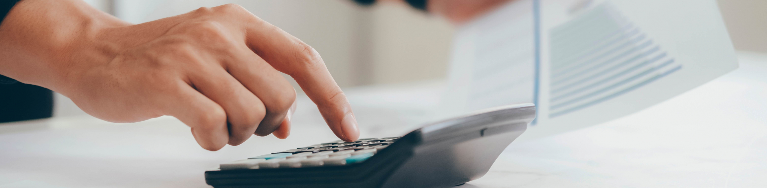 Accountant using calculator to help with work