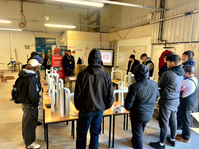 Plastering learners listening to guest talk from Tica Acad