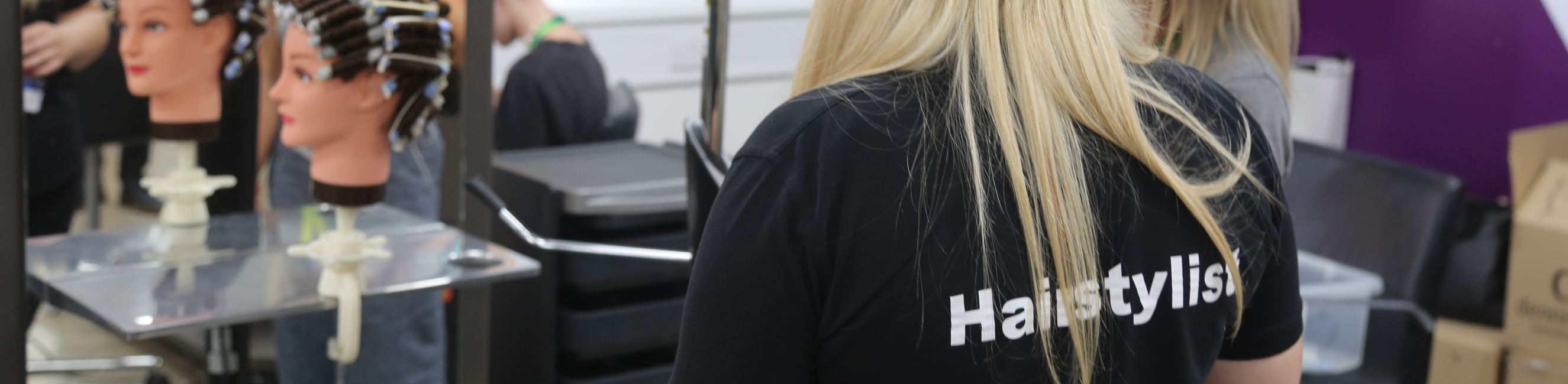 Hairdressing learner in demonstration 