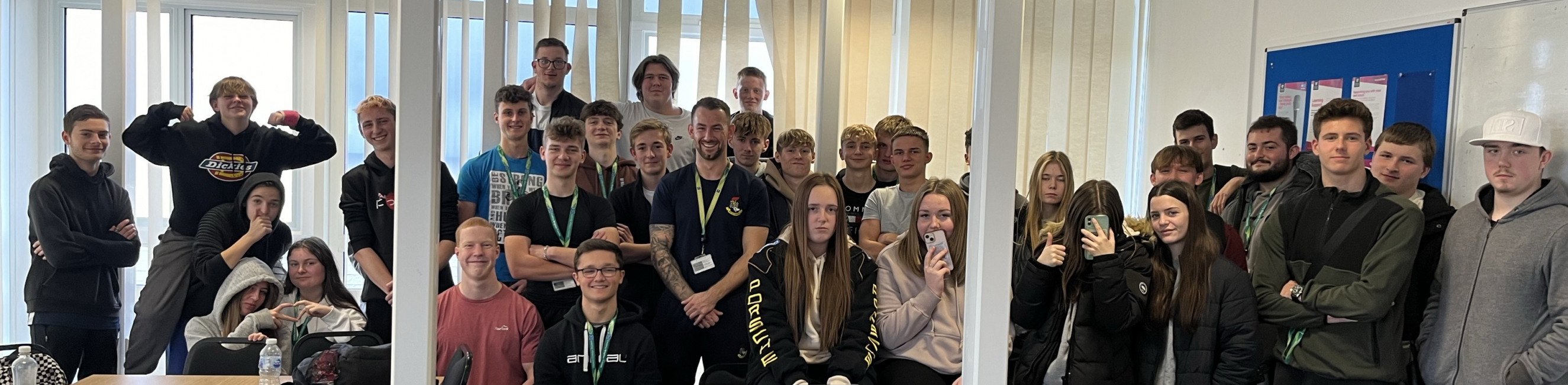 Group photo of public services learners and Tony Wilson