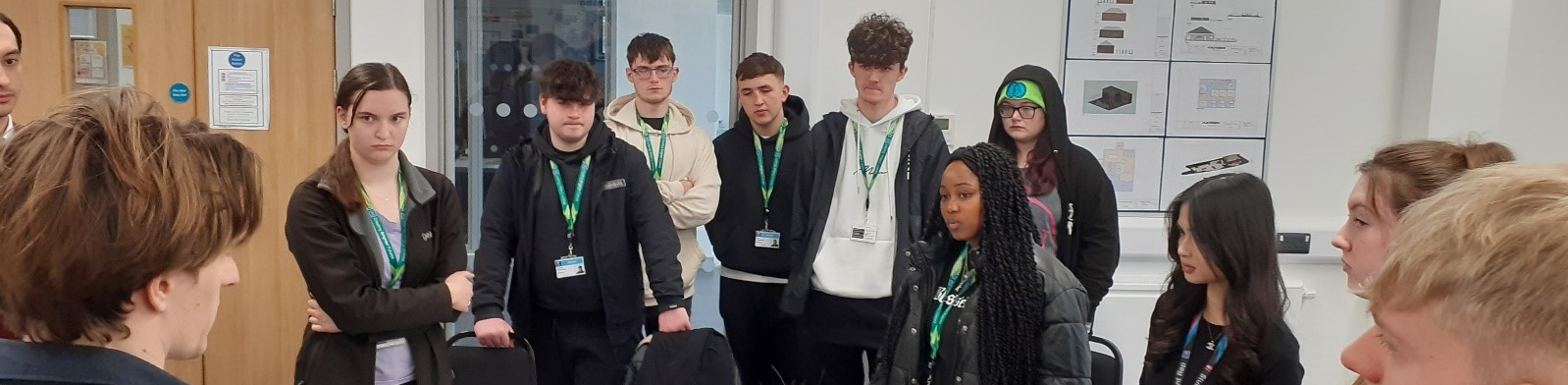 Learners standing and discussing a task