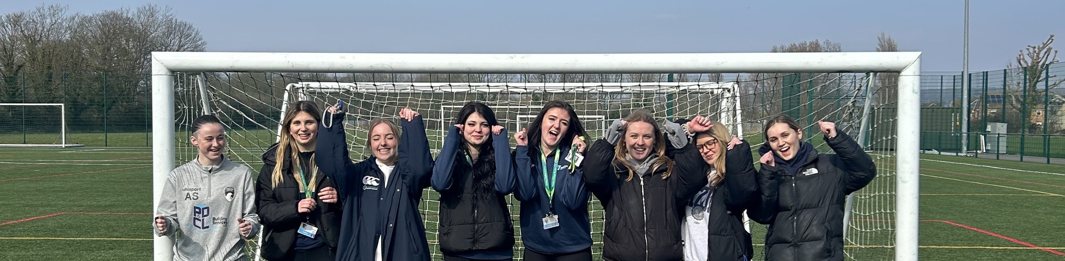 Girls in goal smiling for a picture