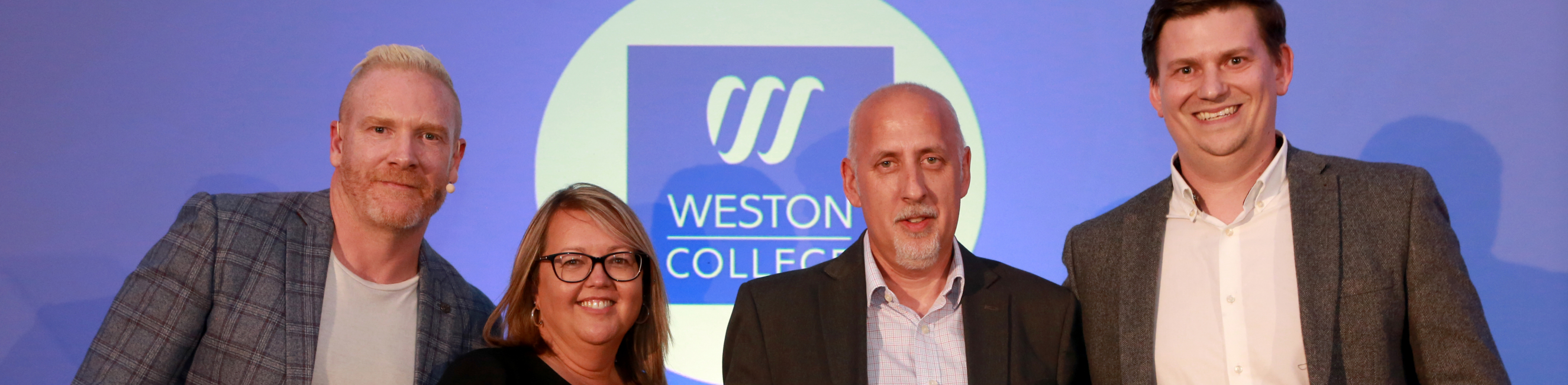 Weston College staff accepting an apprenticeship award