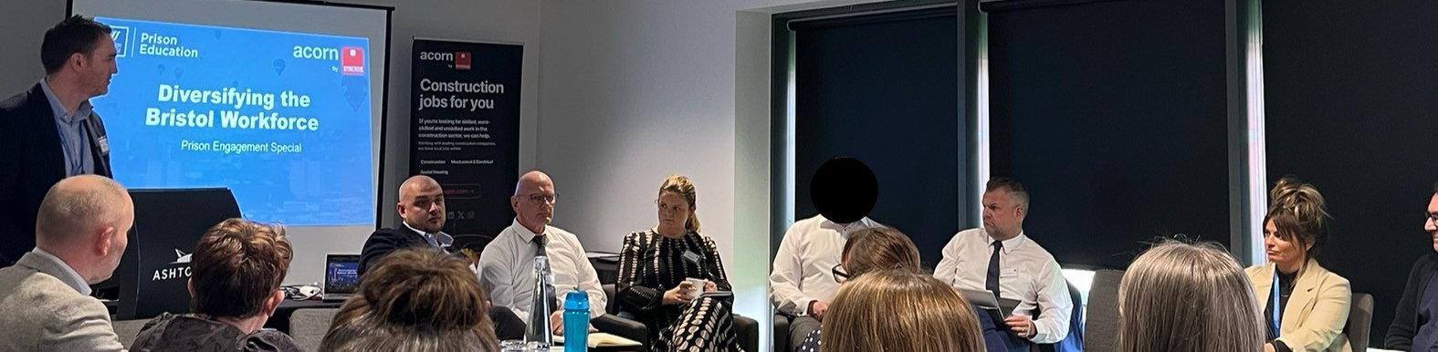 Prison Event attendees watching presentation