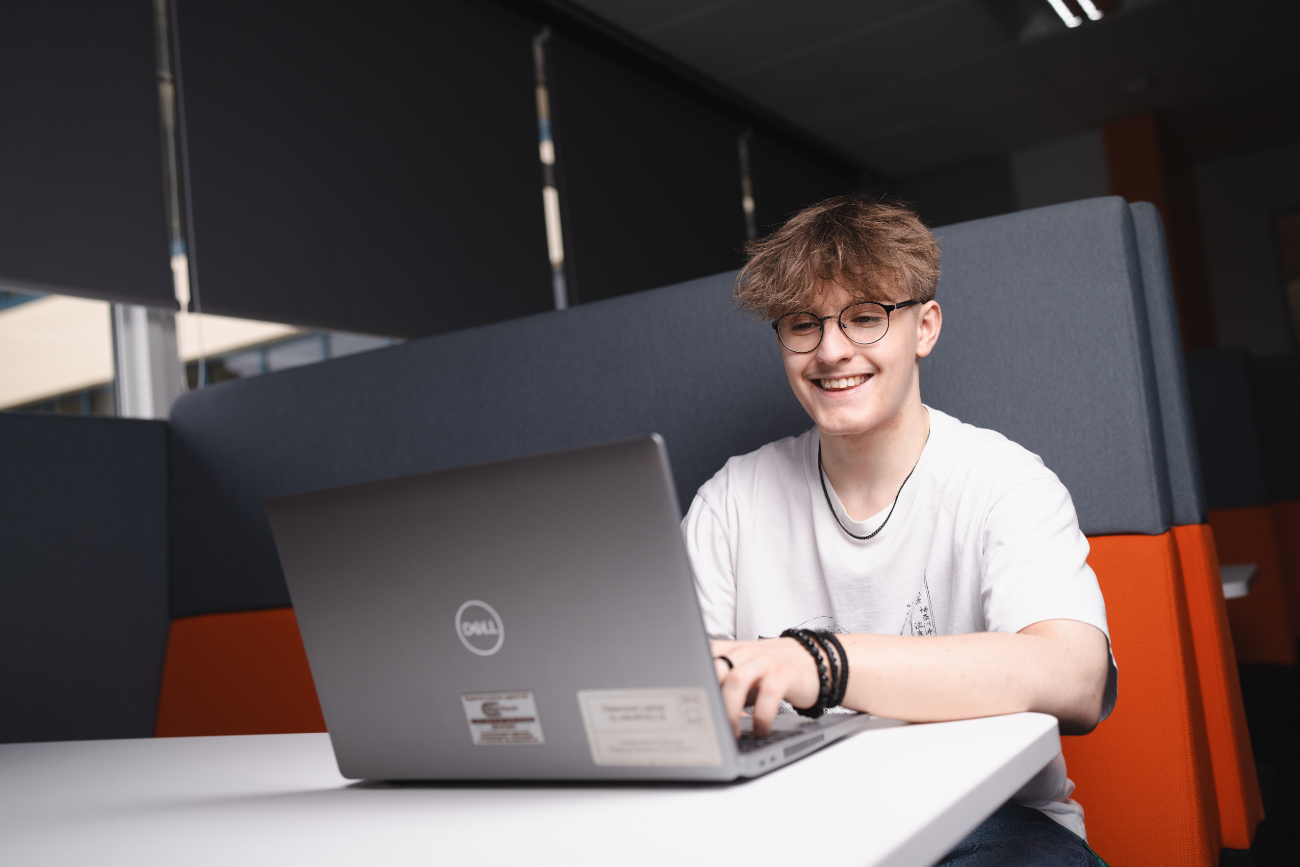 Tom on laptop.