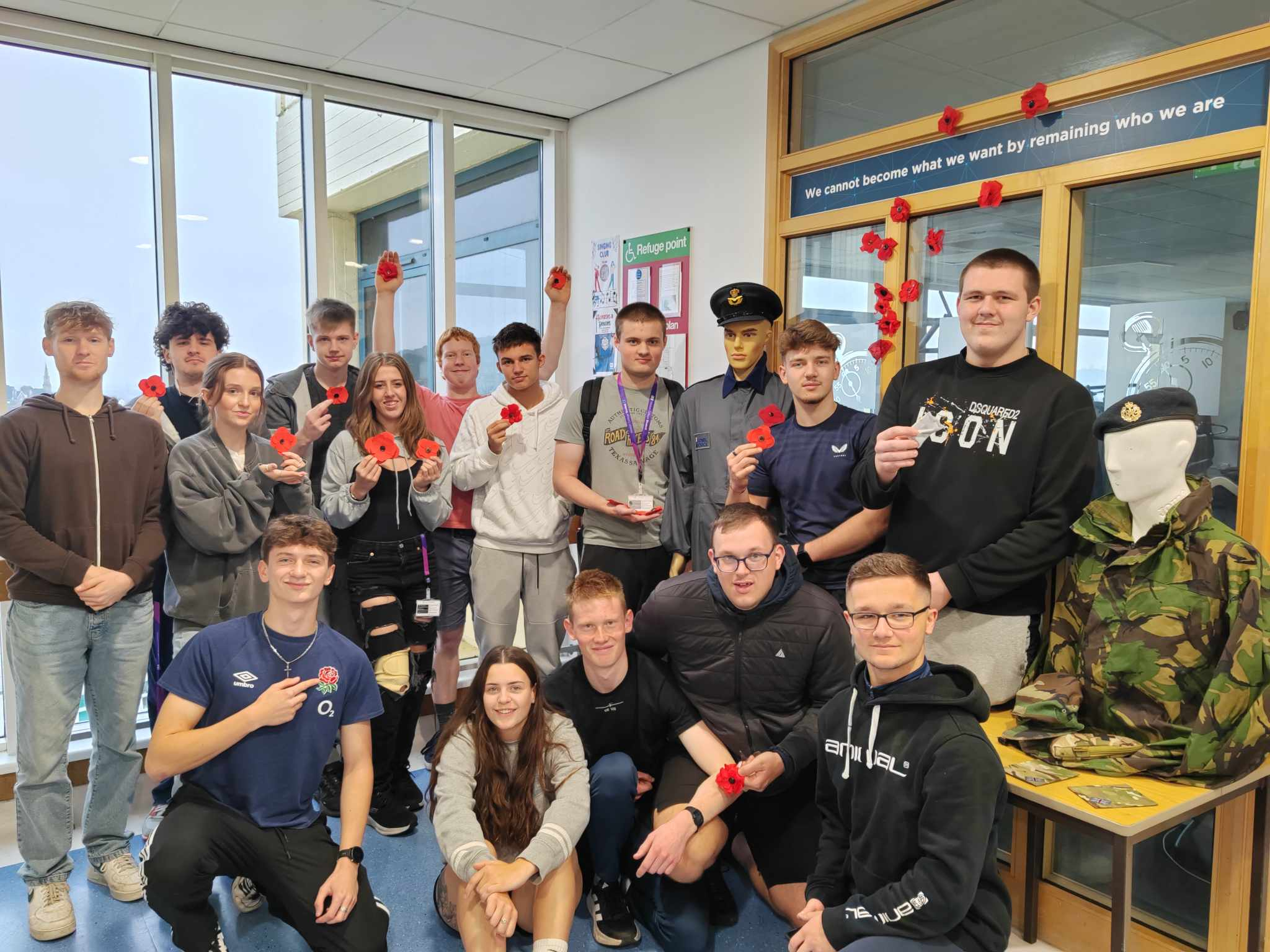 Protective Services learners group photo with the poppies they made