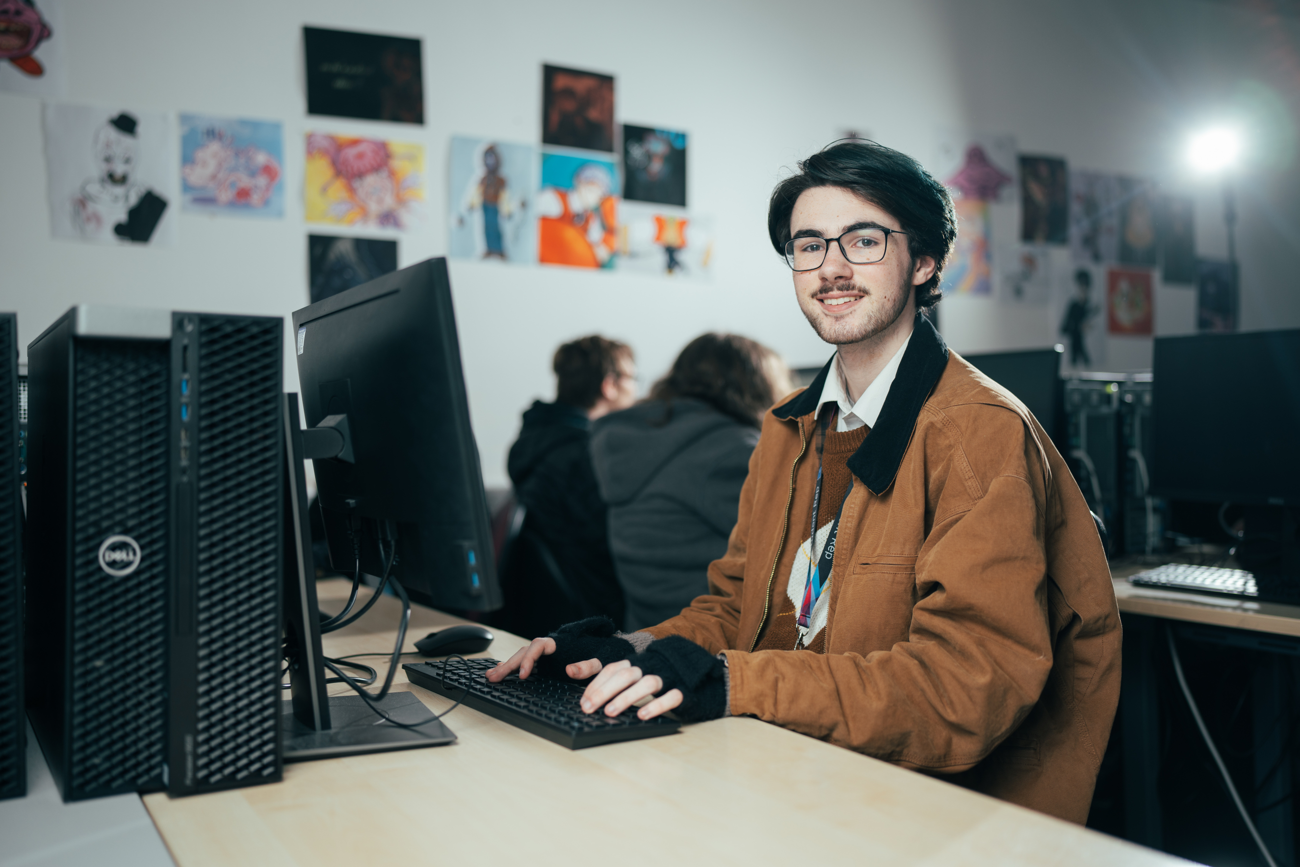 Digital Media student typing on a computer
