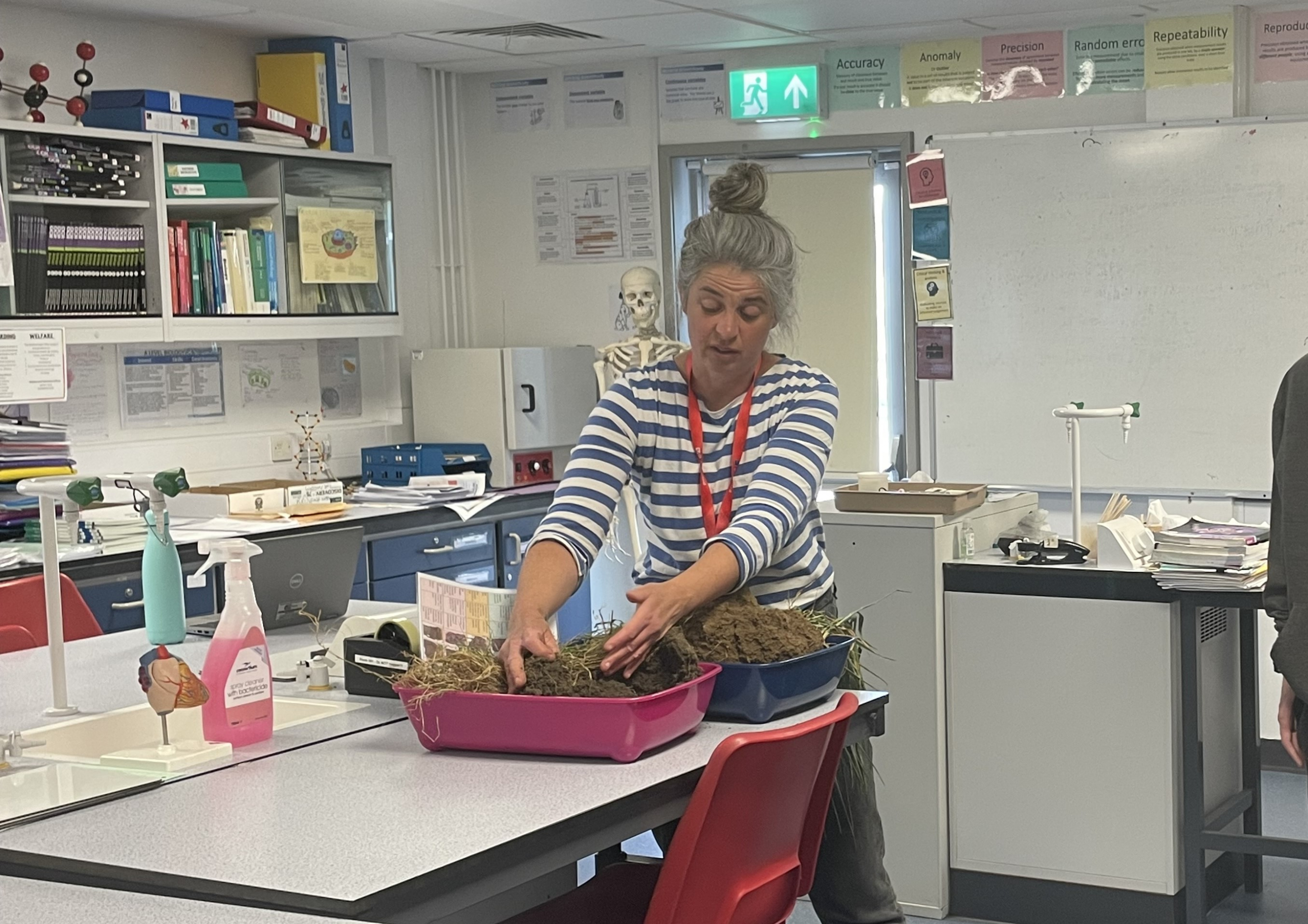 Kate from the Soil Association showing students 2 different types of soil