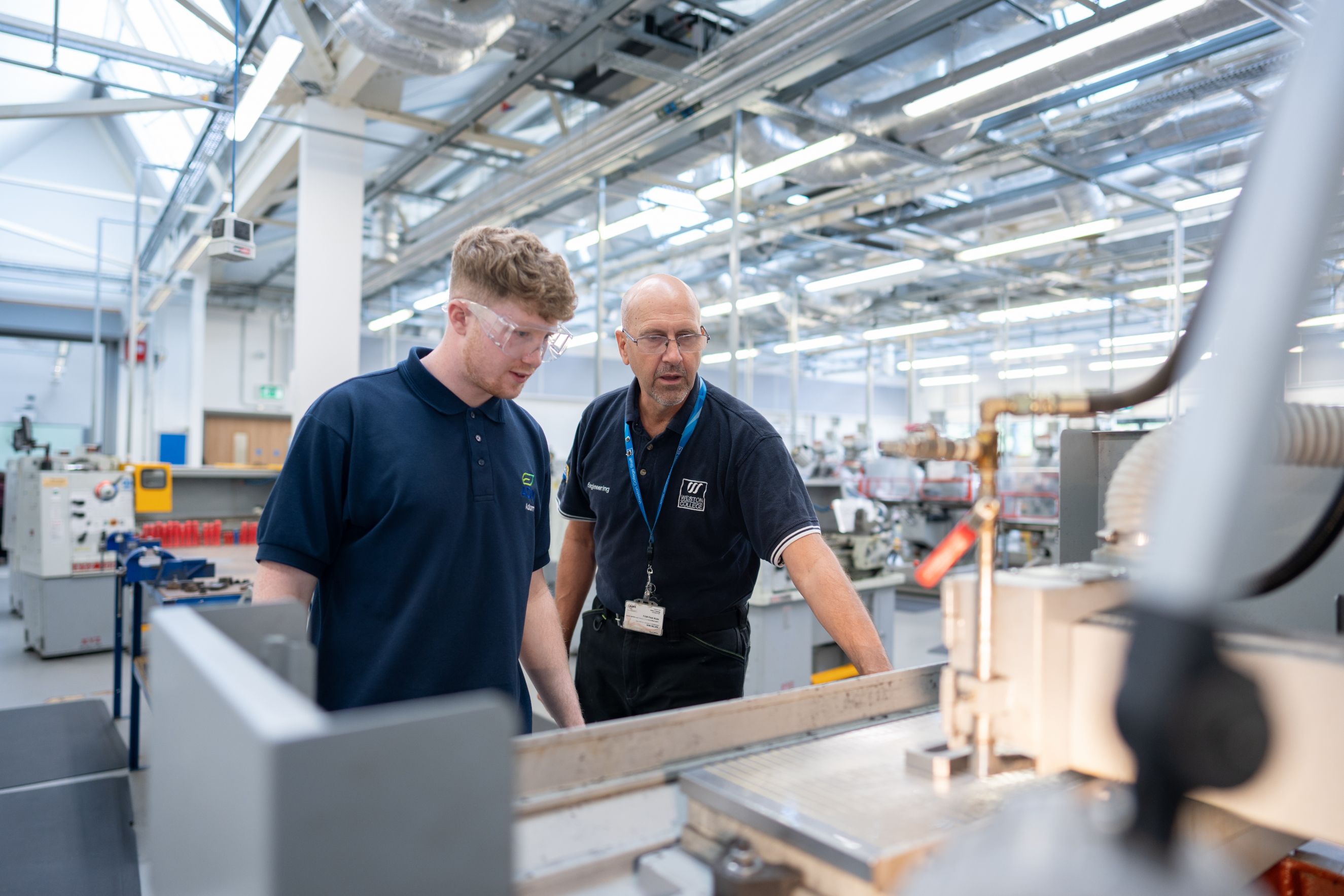Engineering teacher supporting learner