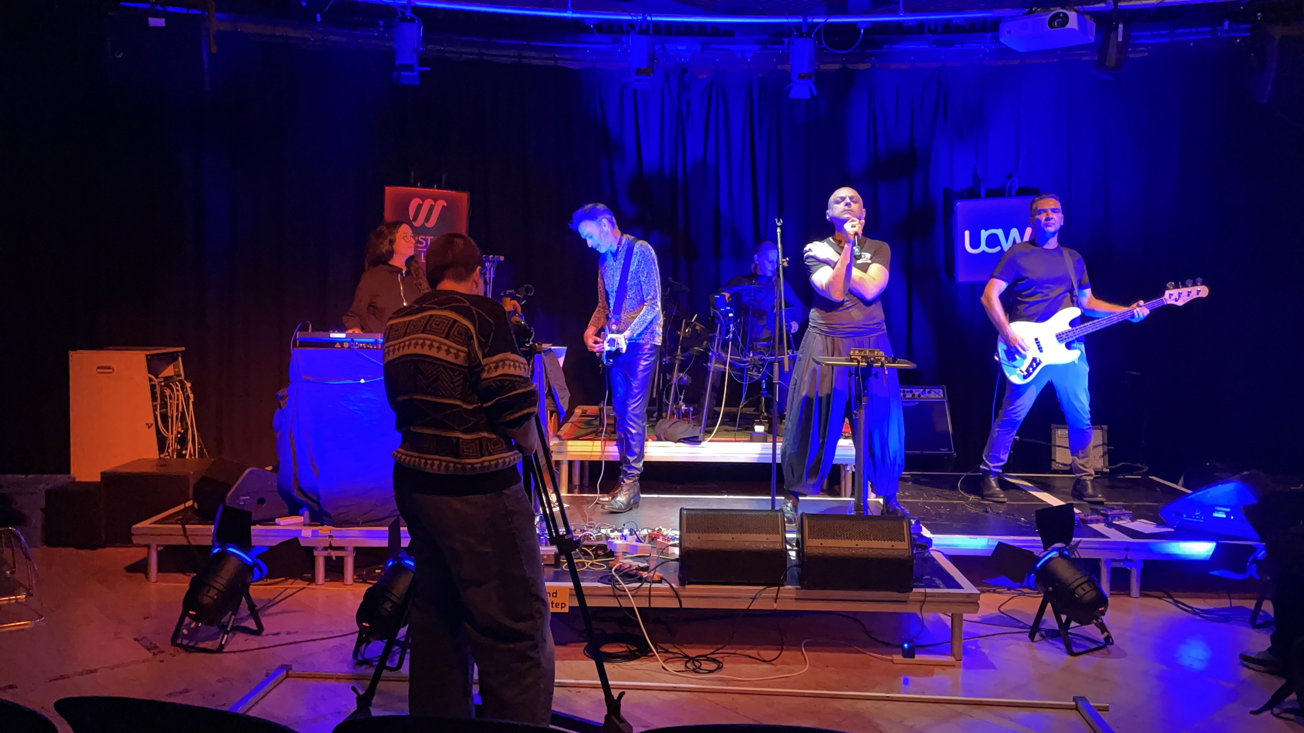Media student recording the Peripheries whilst they perform