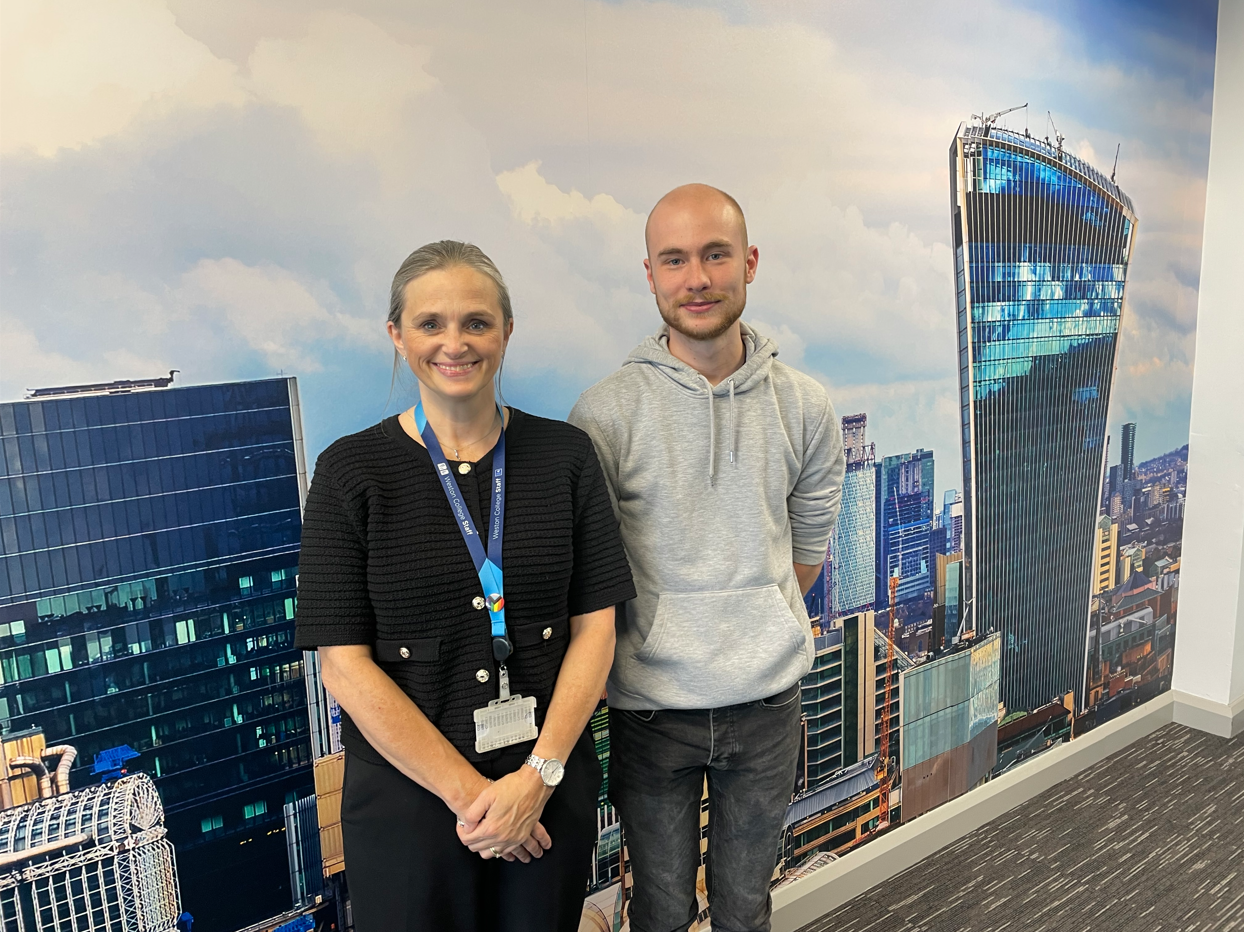Ollie and ex-lecturer, Emma, standing together smiling