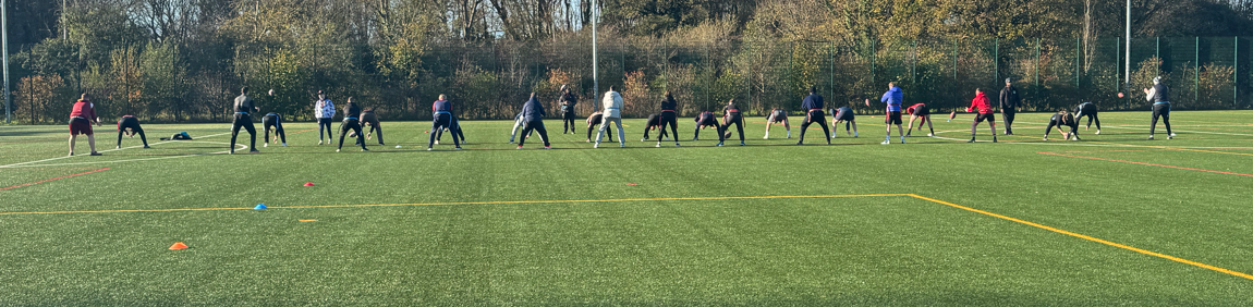 Staff waiting to catch the ball during training