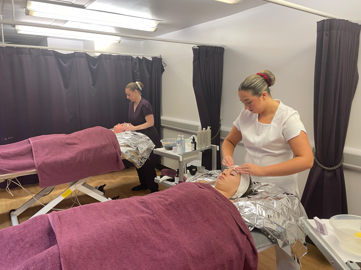Squad UK practicing a time-pressure challenge on Beauty Therapy students
